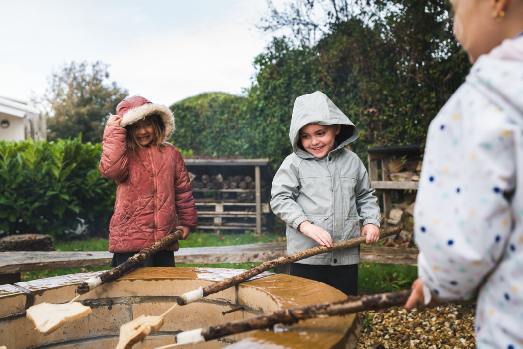 Reception pupils around the fire pit