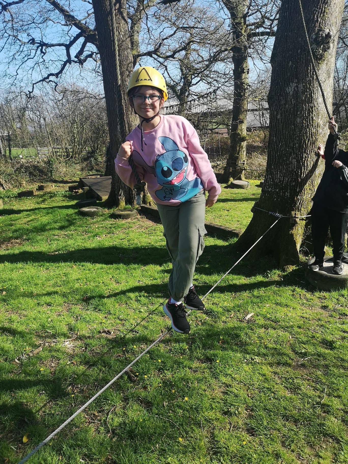 Pupil on low level tight rope