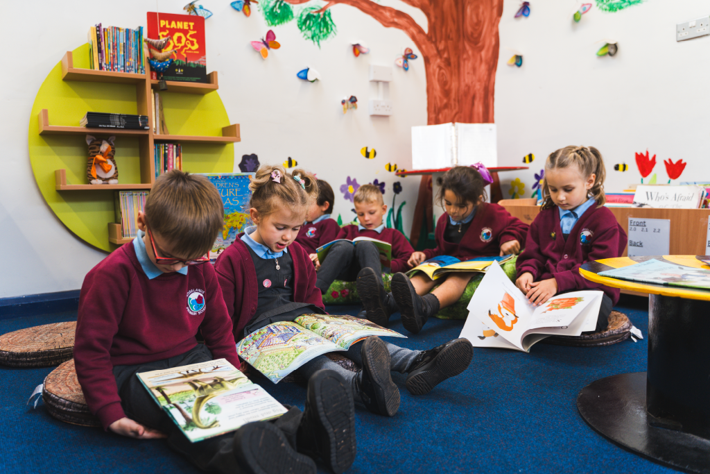 Pupils reading in library area