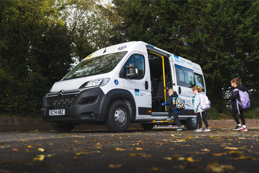 Year 1/2 pupils boarding the school minibus