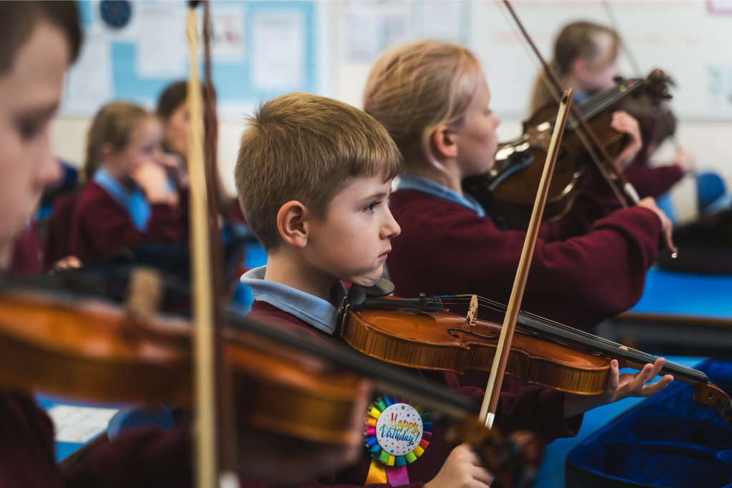 Pupils playing violin Pupils playing violin