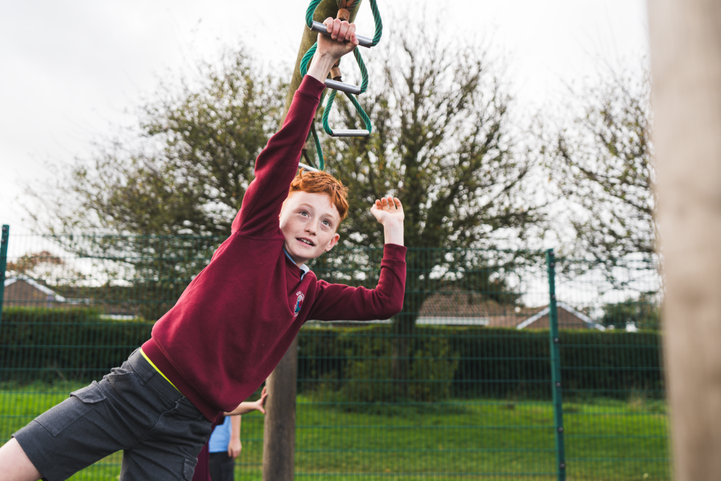 Pupil on climbing frame Pupil on climbing frame