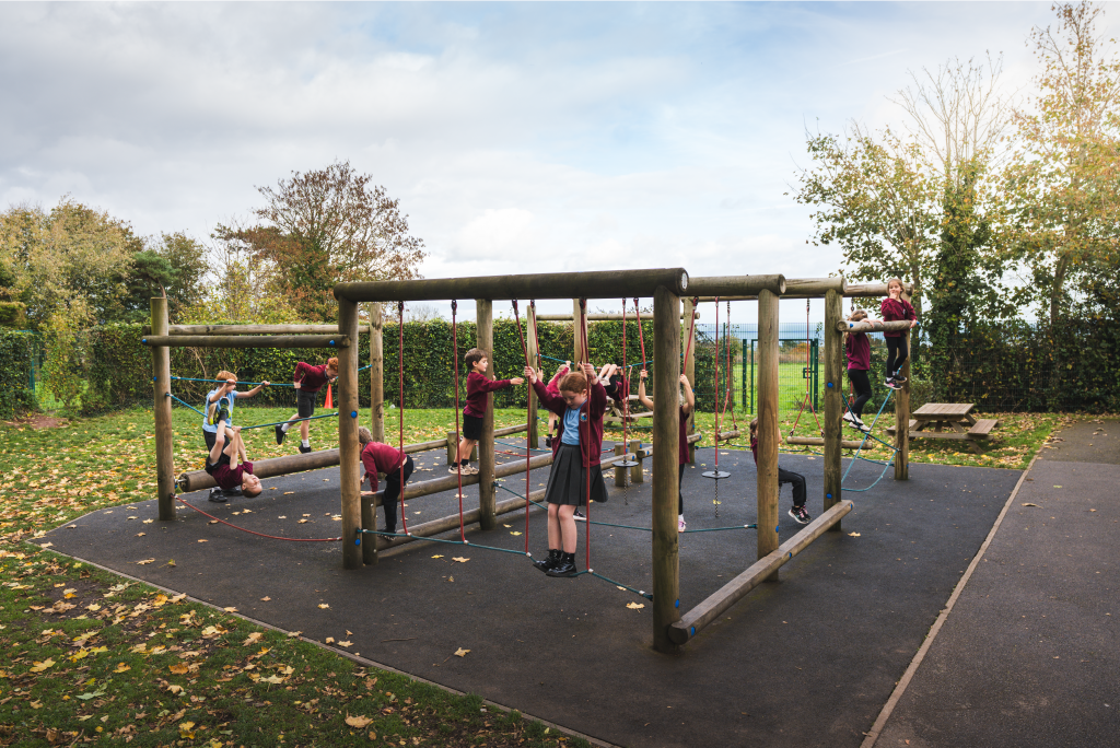 Year 3/4 pupils on outdoor play equipment